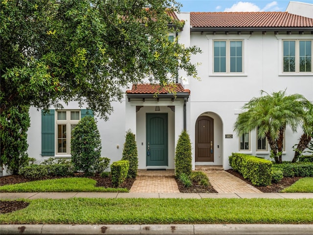 8818 Bismarck Palm Dr, Winter Garden, FL 34787 - mediterranean / spanish home with a tiled roof and stucco siding