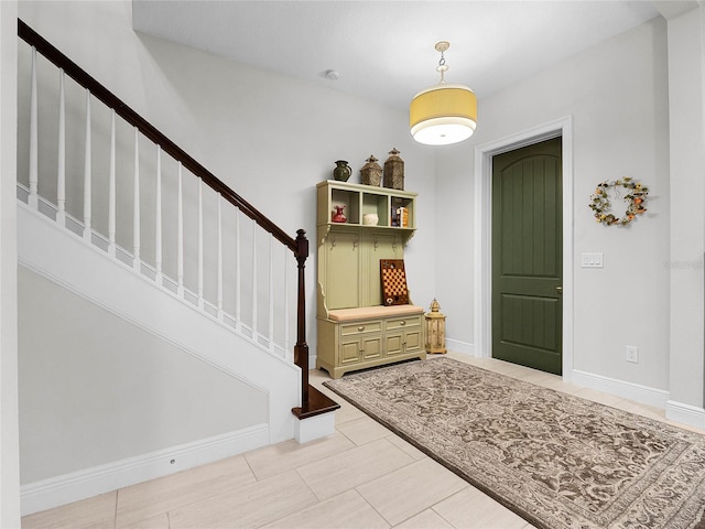 8818 Bismarck Palm Dr, Winter Garden, FL 34787 - foyer entrance featuring stairs, baseboards, and light tile patterned flooring
