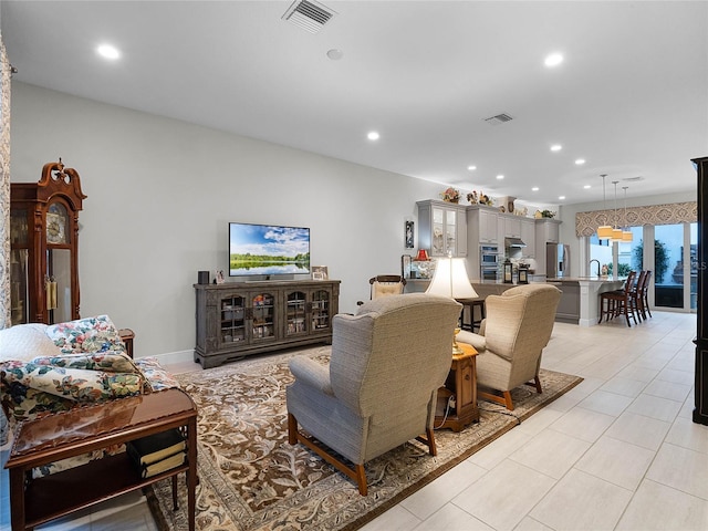 8818 Bismarck Palm Dr, Winter Garden, FL 34787 - living room with recessed lighting and light tile patterned floors