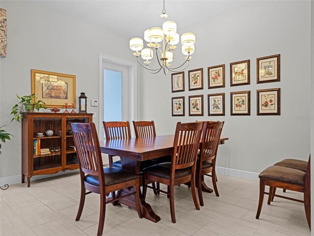 8818 Bismarck Palm Dr, Winter Garden, FL 34787 - dining area featuring a chandelier and baseboards