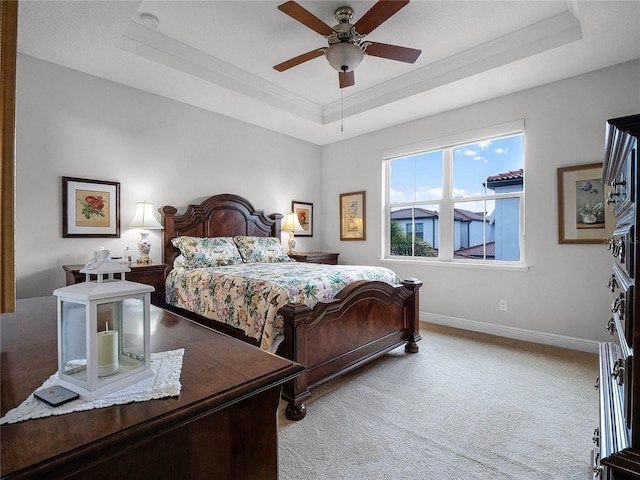 8818 Bismarck Palm Dr, Winter Garden, FL 34787 - carpeted bedroom with a raised ceiling, baseboards, ornamental molding, and ceiling fan