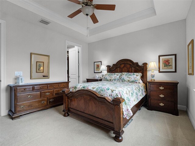 8818 Bismarck Palm Dr, Winter Garden, FL 34787 - bedroom featuring light colored carpet, a raised ceiling, ornamental molding, a ceiling fan, and baseboards