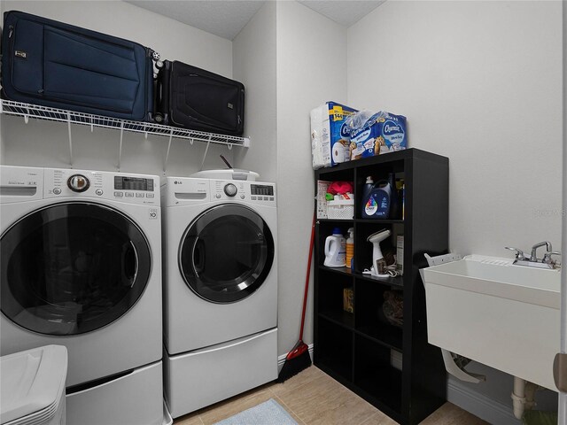 8818 Bismarck Palm Dr, Winter Garden, FL 34787 - laundry area featuring separate washer and dryer
