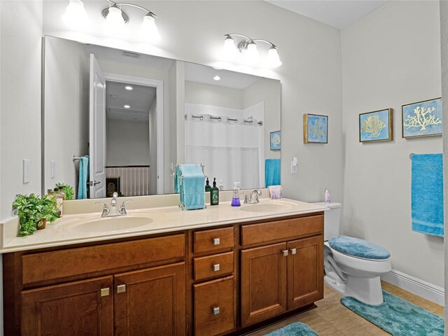 8818 Bismarck Palm Dr, Winter Garden, FL 34787 - full bath featuring double vanity, toilet, tile patterned flooring, curtained shower, and baseboards
