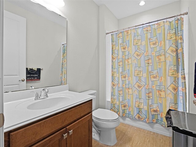 8818 Bismarck Palm Dr, Winter Garden, FL 34787 - bathroom featuring vanity, toilet, shower / bath combo, and tile patterned floors