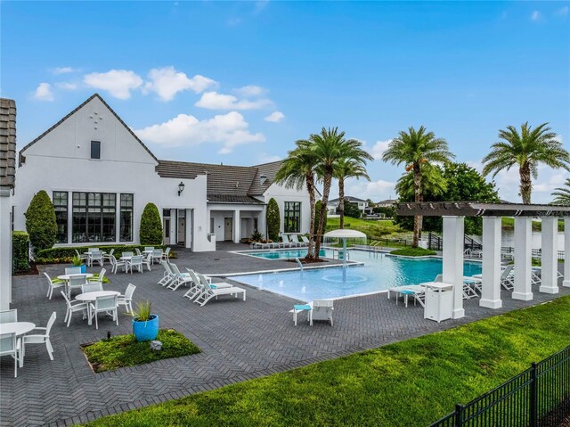 8818 Bismarck Palm Dr, Winter Garden, FL 34787 - community pool with a patio