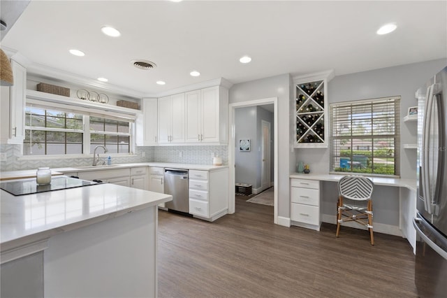 1770 Chinook Trl, Maitland, FL 32751 - kitchen featuring stainless steel appliances, dark wood-style flooring, tasteful backsplash, white cabinets, and recessed lighting
