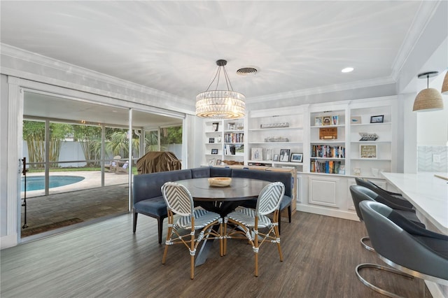 1770 Chinook Trl, Maitland, FL 32751 - dining room with ornamental molding, dark wood-style flooring, and a chandelier