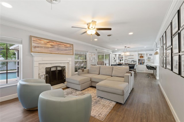 1770 Chinook Trl, Maitland, FL 32751 - living area with a premium fireplace, baseboards, plenty of natural light, dark wood-style floors, and ornamental molding