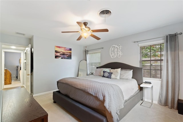 1770 Chinook Trl, Maitland, FL 32751 - bedroom featuring light carpet, multiple windows, baseboards, and a ceiling fan