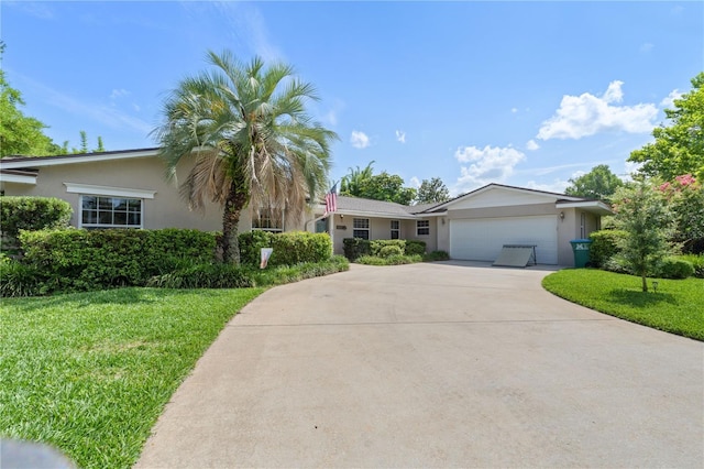 1770 Chinook Trl, Maitland, FL 32751 - ranch-style house featuring stucco siding, concrete driveway, a garage, and a front yard