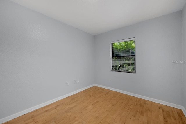 1021 N Forest Ave, Orlando, FL 32803 - empty room featuring baseboards and light wood finished floors