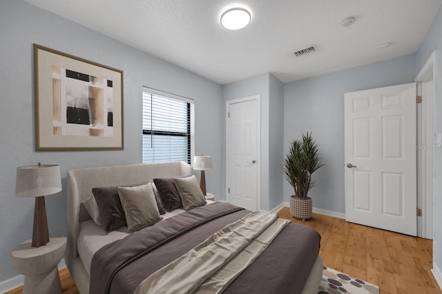 1021 N Forest Ave, Orlando, FL 32803 - bedroom with light wood-type flooring and baseboards
