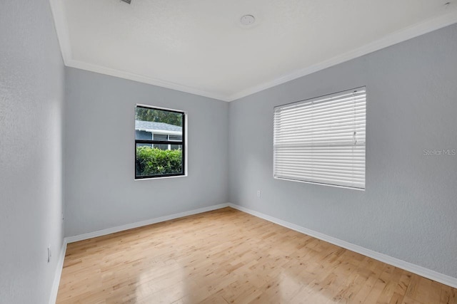 1021 N Forest Ave, Orlando, FL 32803 - unfurnished room featuring wood finished floors, ornamental molding, and baseboards