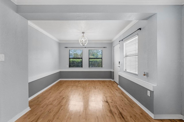 1021 N Forest Ave, Orlando, FL 32803 - unfurnished dining area with a chandelier, wood finished floors, ornamental molding, and baseboards