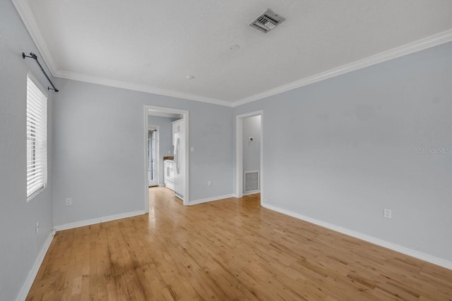 1021 N Forest Ave, Orlando, FL 32803 - unfurnished room featuring ornamental molding, light wood-style floors, and baseboards