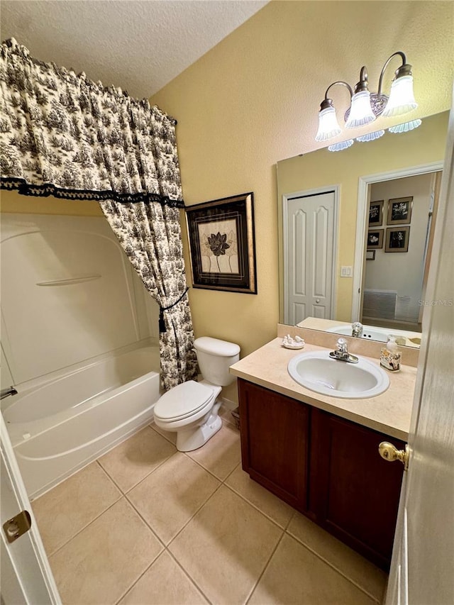 10350 Lake District Ln Unit S, Orlando, FL 32832 - bathroom with toilet, tile patterned floors, shower / bath combination with curtain, vanity, and a textured ceiling