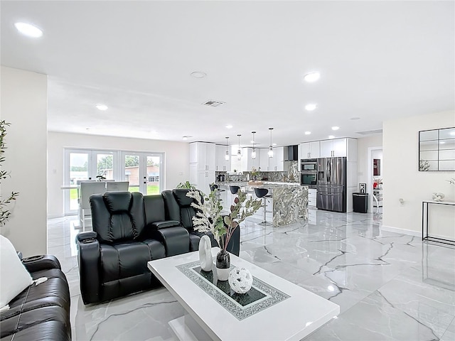 516 Petes Ln, Davenport, FL 33837 - living room featuring recessed lighting, light marble finish floors, and baseboards