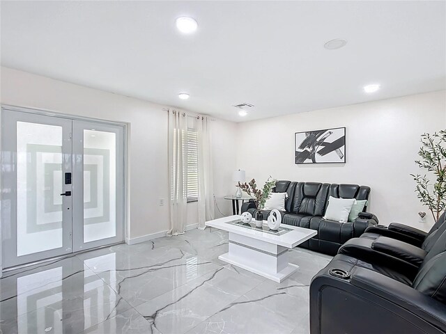 516 Petes Ln, Davenport, FL 33837 - living area with recessed lighting, light marble finish floors, french doors, and baseboards