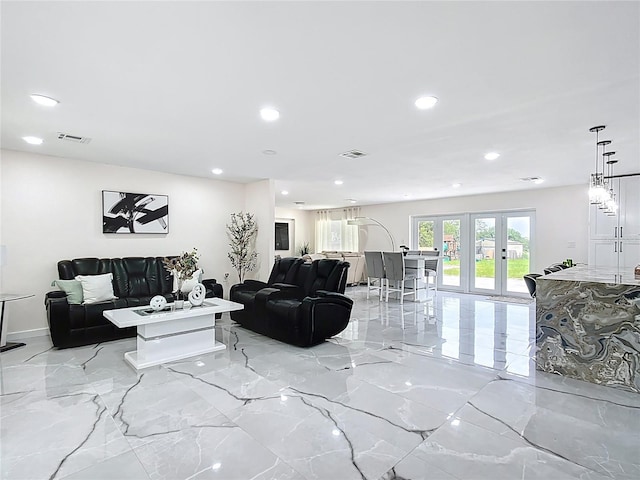 516 Petes Ln, Davenport, FL 33837 - living area with light marble finish flooring, recessed lighting, and french doors