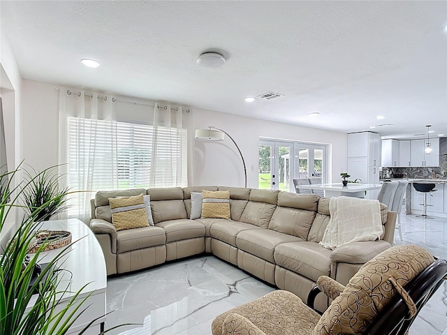 516 Petes Ln, Davenport, FL 33837 - living room featuring light marble finish floors and recessed lighting