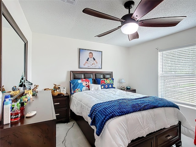 516 Petes Ln, Davenport, FL 33837 - bedroom featuring a textured ceiling and a ceiling fan