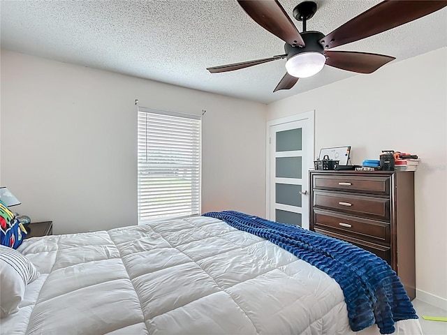 516 Petes Ln, Davenport, FL 33837 - bedroom with a textured ceiling and ceiling fan