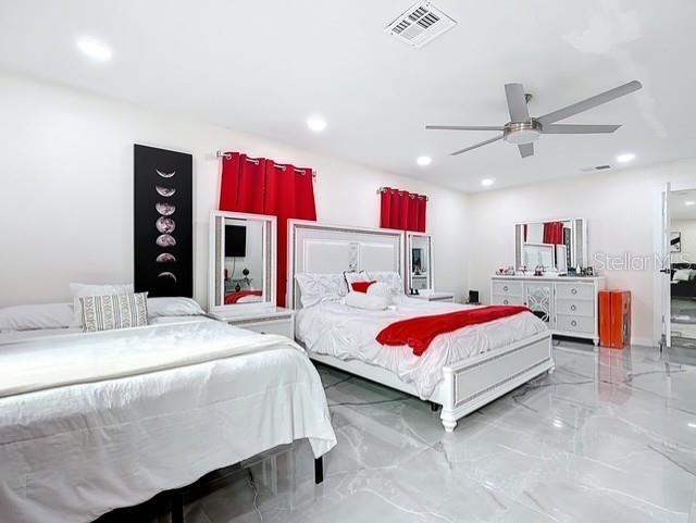 516 Petes Ln, Davenport, FL 33837 - bedroom with marble tiled flooring, recessed lighting, and ceiling fan