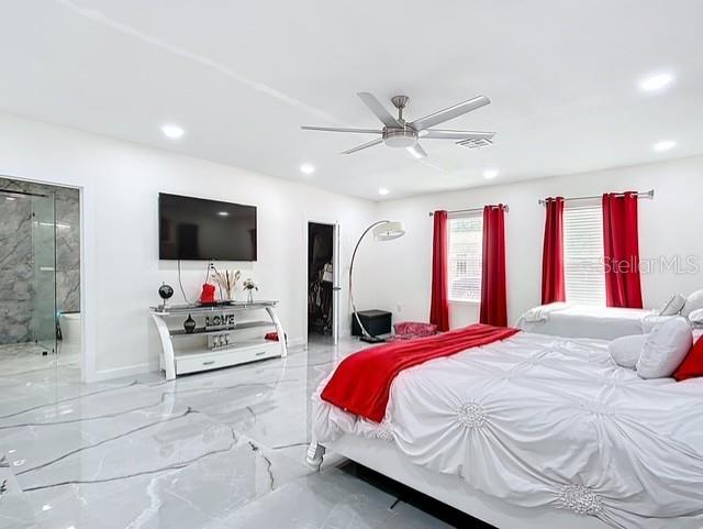 516 Petes Ln, Davenport, FL 33837 - bedroom with recessed lighting, marble finish floors, baseboards, ceiling fan, and ensuite bathroom