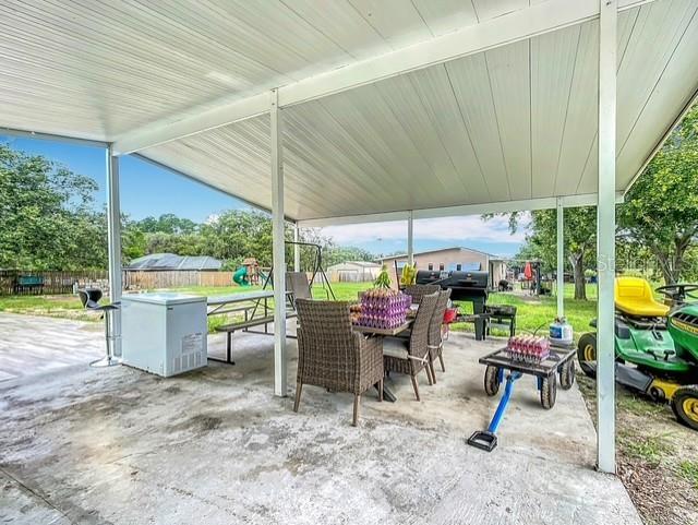 516 Petes Ln, Davenport, FL 33837 - view of patio / terrace featuring outdoor dining space