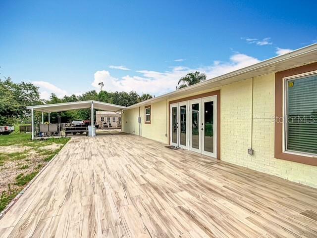 516 Petes Ln, Davenport, FL 33837 - deck featuring french doors