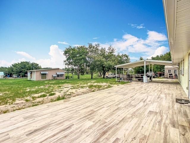 516 Petes Ln, Davenport, FL 33837 - wooden terrace featuring concrete driveway