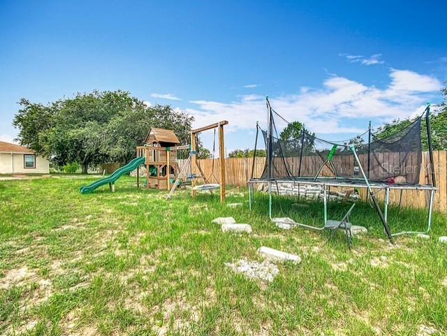 516 Petes Ln, Davenport, FL 33837 - view of play area featuring a trampoline