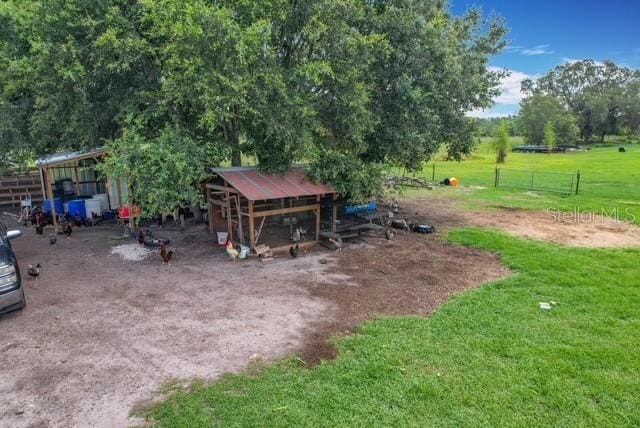 516 Petes Ln, Davenport, FL 33837 - view of yard with exterior structure and an outdoor structure