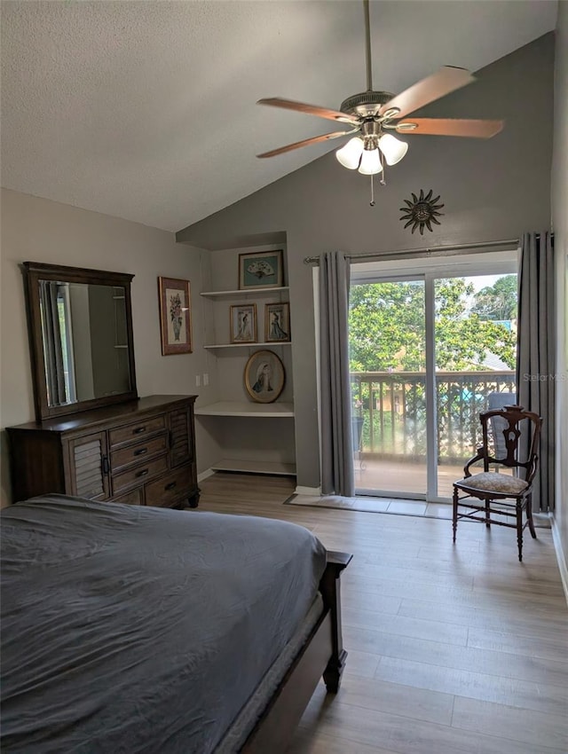 1051 S Highland St Unit 5E, Mount Dora, FL 32757 - bedroom featuring access to outside, lofted ceiling, wood finished floors, a textured ceiling, and a ceiling fan