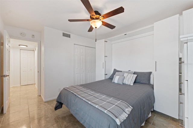 6210 Sun Blvd Unit 206, Saint Petersburg, FL 33715 - bedroom featuring a closet, ceiling fan, and light tile patterned floors