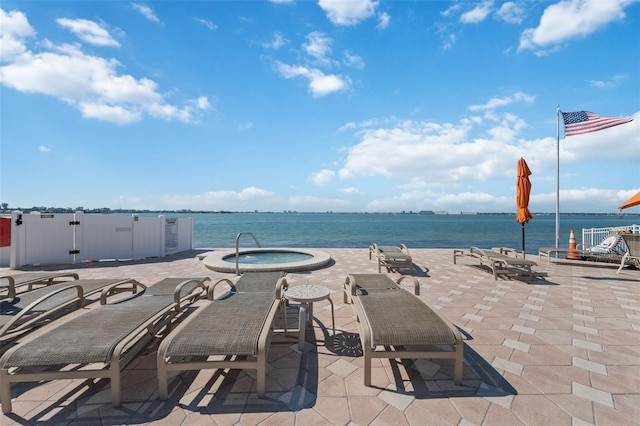 6210 Sun Blvd Unit 206, Saint Petersburg, FL 33715 - view of patio with a hot tub and a water view