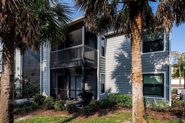 3748 Idlebrook Cir Unit 202, Casselberry, FL 32707 - back of house with a sunroom and a balcony