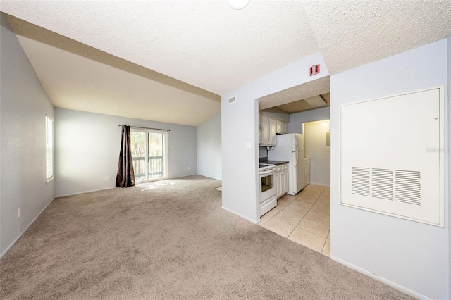 3748 Idlebrook Cir Unit 202, Casselberry, FL 32707 - unfurnished living room featuring light carpet, baseboards, and light tile patterned flooring
