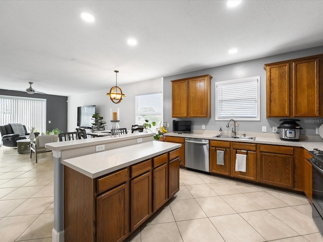 204 Cotswold Cir, Davenport, FL 33837 - kitchen with stainless steel dishwasher, a sink, light countertops, brown cabinetry, and recessed lighting
