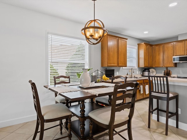 204 Cotswold Cir, Davenport, FL 33837 - dining space featuring a chandelier, light tile patterned floors, recessed lighting, and baseboards