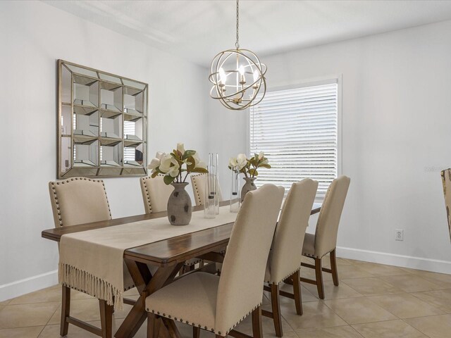 204 Cotswold Cir, Davenport, FL 33837 - dining room featuring a chandelier, baseboards, and light tile patterned floors