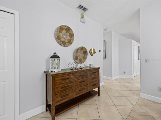 204 Cotswold Cir, Davenport, FL 33837 - corridor featuring light tile patterned flooring and baseboards