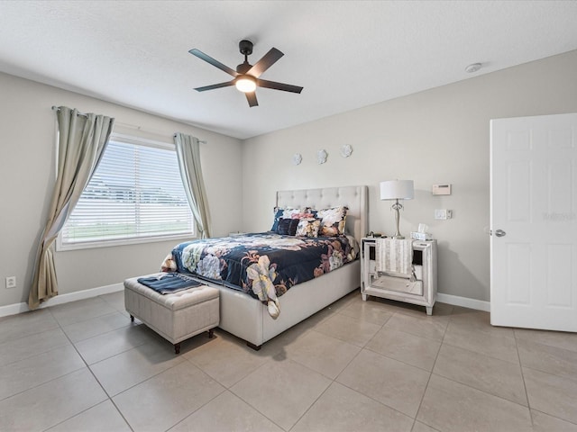 204 Cotswold Cir, Davenport, FL 33837 - bedroom featuring baseboards, light tile patterned floors, and a ceiling fan
