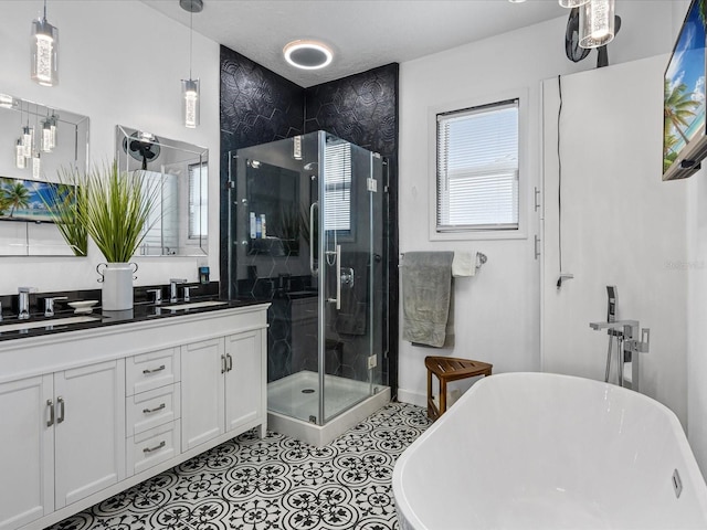 204 Cotswold Cir, Davenport, FL 33837 - bathroom with double vanity, a stall shower, and a soaking tub