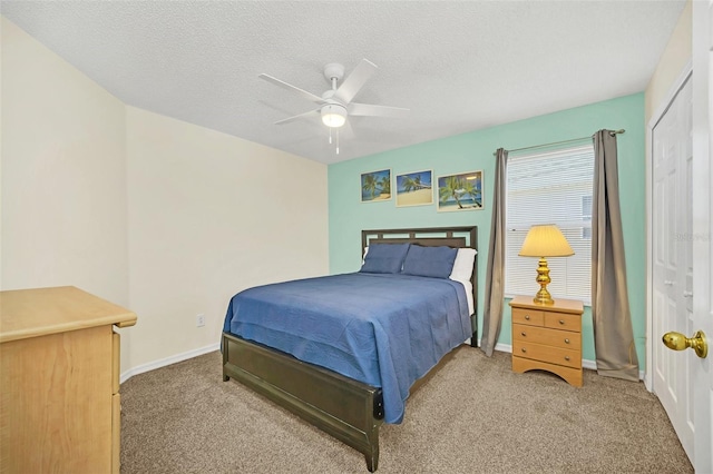 8622 La Isla Dr, Kissimmee, FL 34747 - bedroom featuring carpet floors, a ceiling fan, a textured ceiling, and baseboards