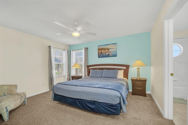 8622 La Isla Dr, Kissimmee, FL 34747 - carpeted bedroom featuring multiple windows, baseboards, a ceiling fan, and a textured ceiling