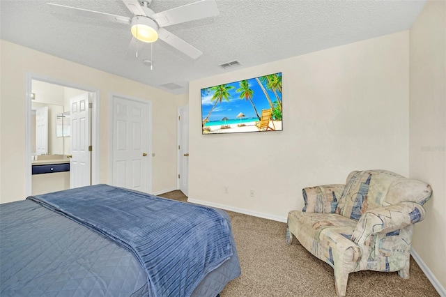 8622 La Isla Dr, Kissimmee, FL 34747 - bedroom with carpet flooring, baseboards, a ceiling fan, a textured ceiling, and ensuite bath