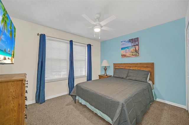 8622 La Isla Dr, Kissimmee, FL 34747 - carpeted bedroom featuring baseboards, ceiling fan, and a textured ceiling