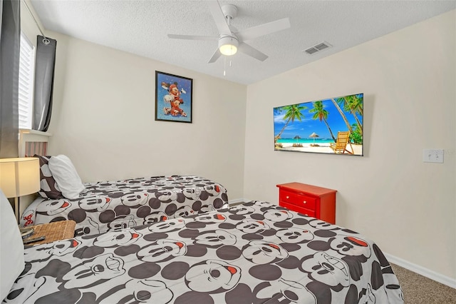 8622 La Isla Dr, Kissimmee, FL 34747 - carpeted bedroom featuring a textured ceiling, ceiling fan, and baseboards